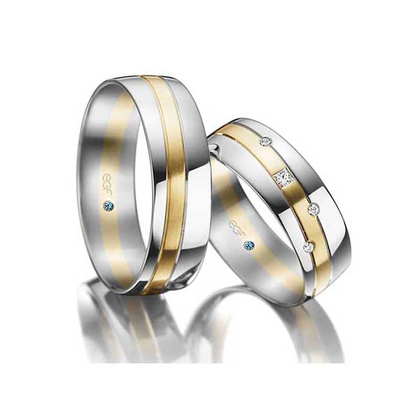 Trouwringen-van-7-mm-breed-wit-met-geelgouden-Saturnus-baan-Circles-Trouwringen-Zwijndrecht