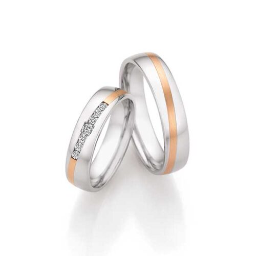 trouwringen met roodgouden Saturnusvoeg