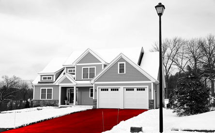 house in residential area after snow