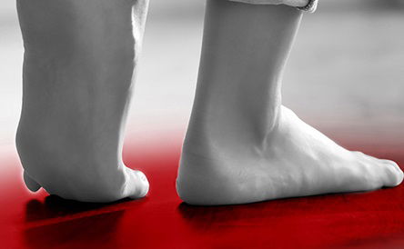 Barefoot woman at home, closeup. Floor heating system